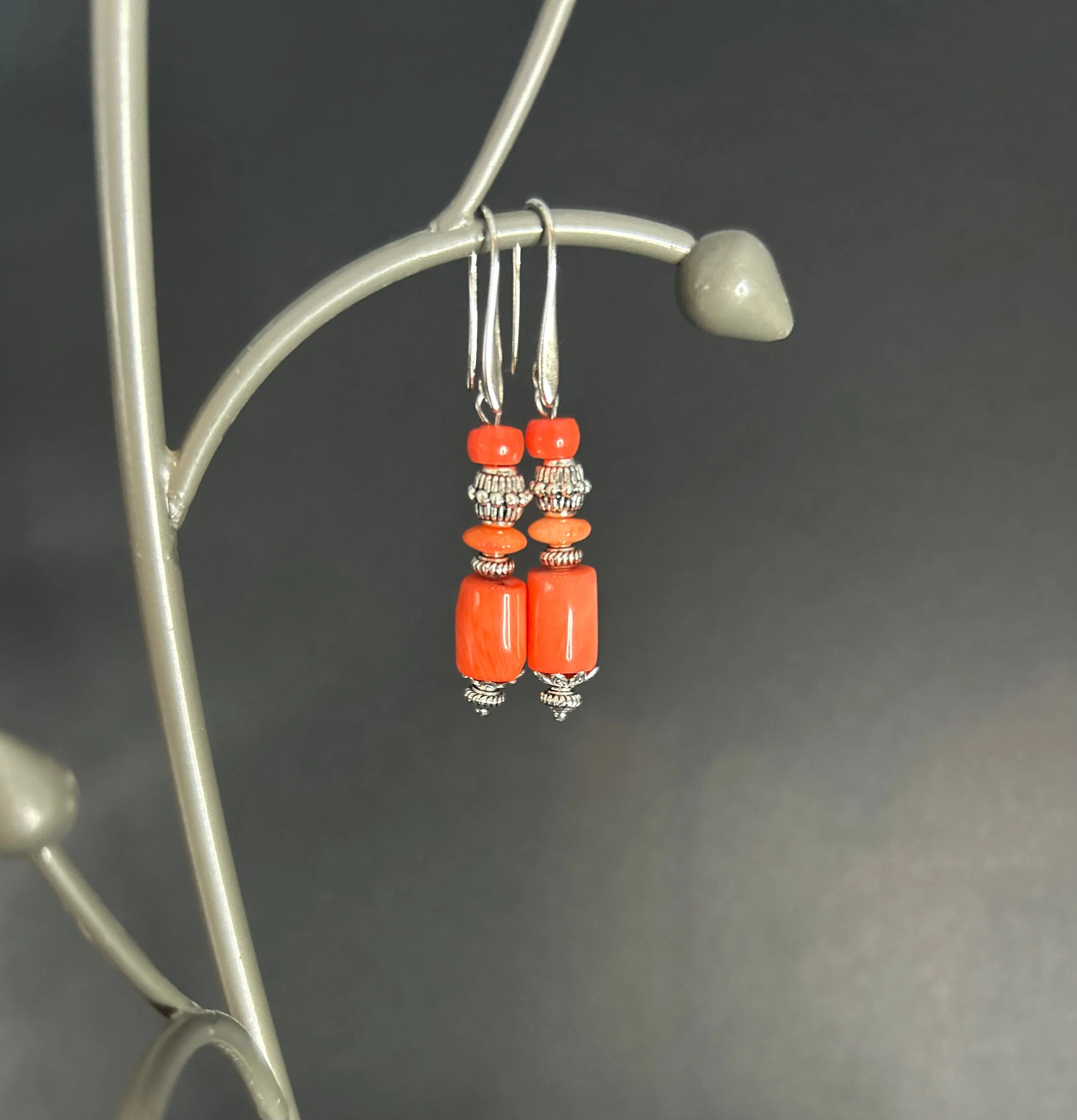 Sure! To optimize the title of a product like Coral Earrings for an e-commerce platform, youll want to include descriptive modifiers that highlight the features, style, and appeal of the product. Heres a suggestion:

Elegant Handmade Coral Earrings - Natural Red Gemstone, Sterling Silver Hooks

This title includes:

1. Elegant to convey a sense of style.
2. Handmade to indicate craftsmanship.
3. Natural Red Gemstone to specify the material and color.
4. Sterling Silver Hooks to highlight a detail that might be important to customers interested in quality and comfort.