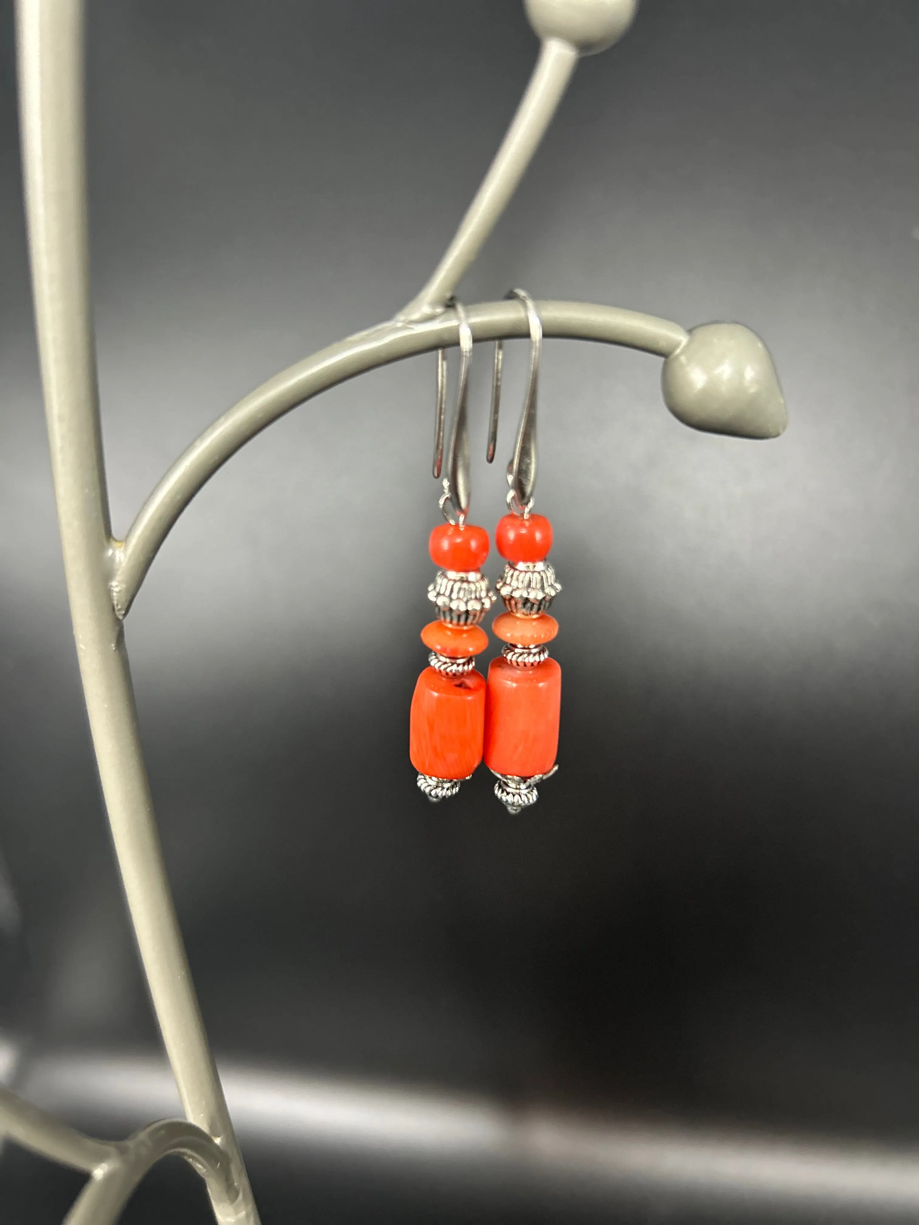 Sure! To optimize the title of a product like Coral Earrings for an e-commerce platform, youll want to include descriptive modifiers that highlight the features, style, and appeal of the product. Heres a suggestion:

Elegant Handmade Coral Earrings - Natural Red Gemstone, Sterling Silver Hooks

This title includes:

1. Elegant to convey a sense of style.
2. Handmade to indicate craftsmanship.
3. Natural Red Gemstone to specify the material and color.
4. Sterling Silver Hooks to highlight a detail that might be important to customers interested in quality and comfort.